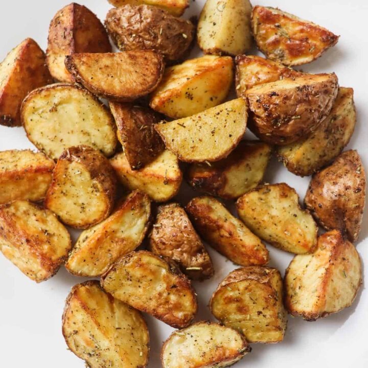 roasted potato pieces on white plate